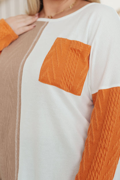 Close up of Cleo Colorblock Top showing textured knit and patch pocket