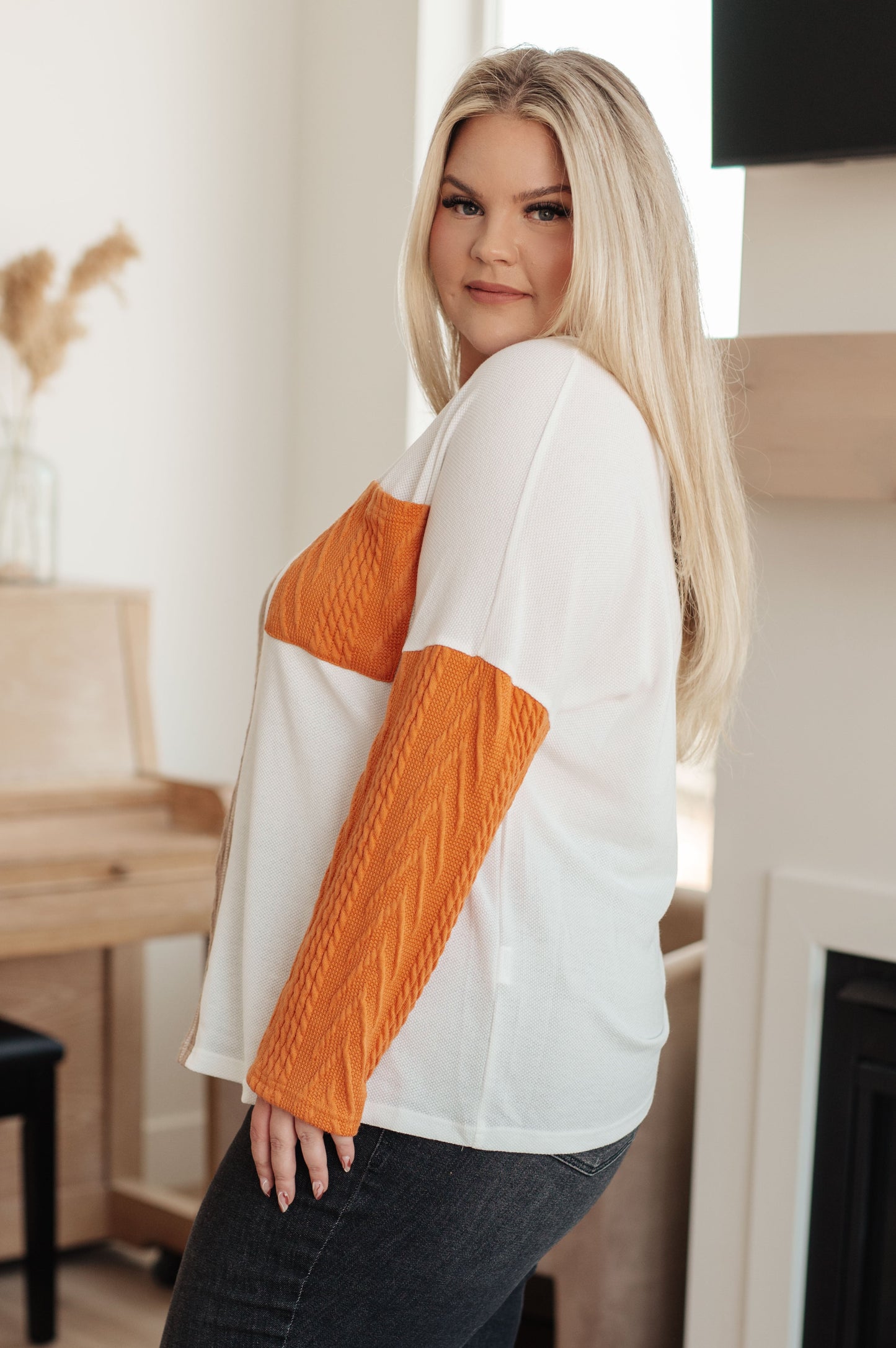 Plus size side view of Cleo Colorblock Top showing drop shoulder fit