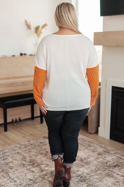 Plus size back view of Cleo Colorblock Top with white panel and orange sleeves