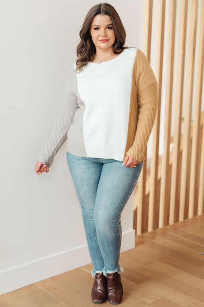 Plus size model in Makenna Color Block Sweater with jeans and ankle boots.