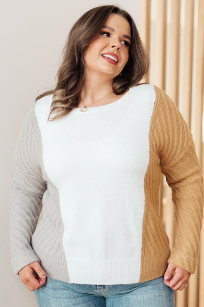 Plus size model wearing Makenna Color Block Sweater showing color block and slim fit.