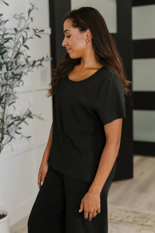 Thyme Boxy Tee in Black side angle showing ribbed knit and relaxed drape