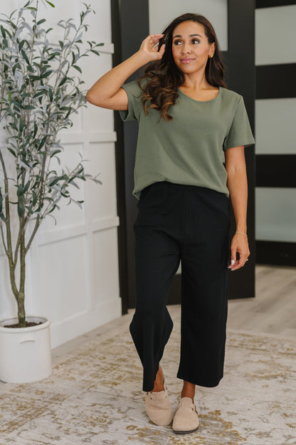Model wearing Thyme Boxy Tee in Dusty Pine styled with Thyme Culottes in Black