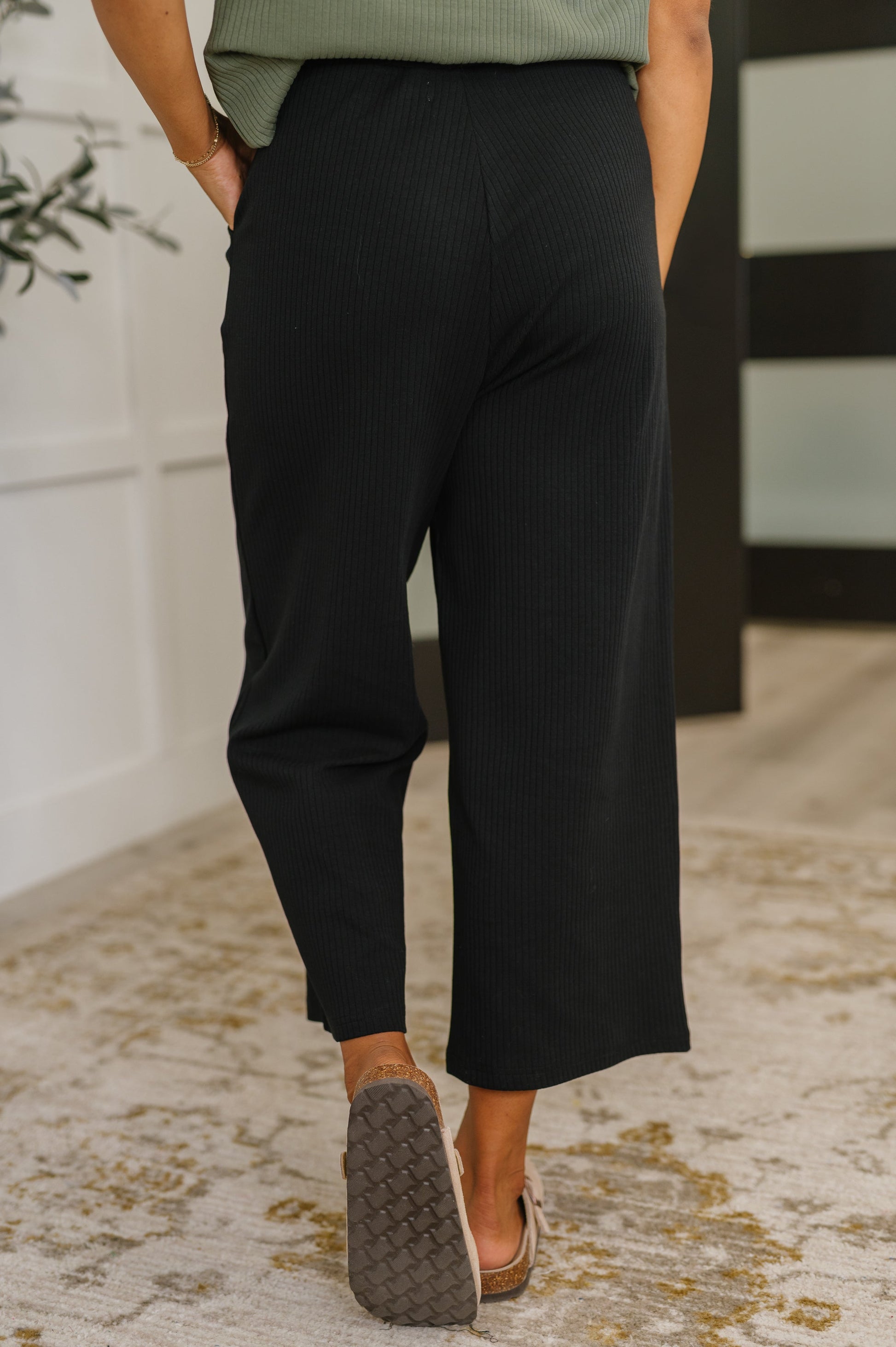 Thyme Culottes in Black back view showing high waist and relaxed silhouette