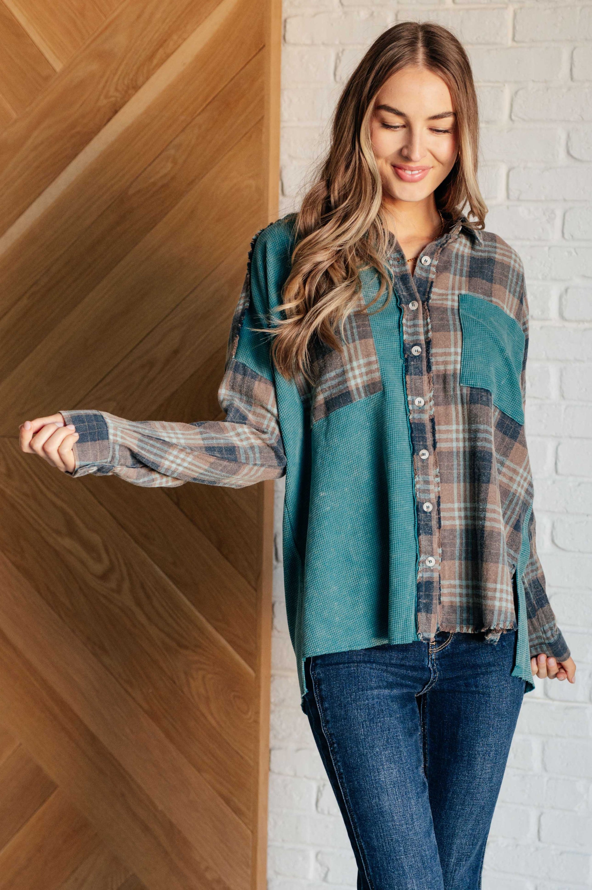 Women's teal plaid button-up shirt with a mix of flannel and waffle knit, featuring chest pockets, button-up closure, and a raw hem for a modern and stylish look.