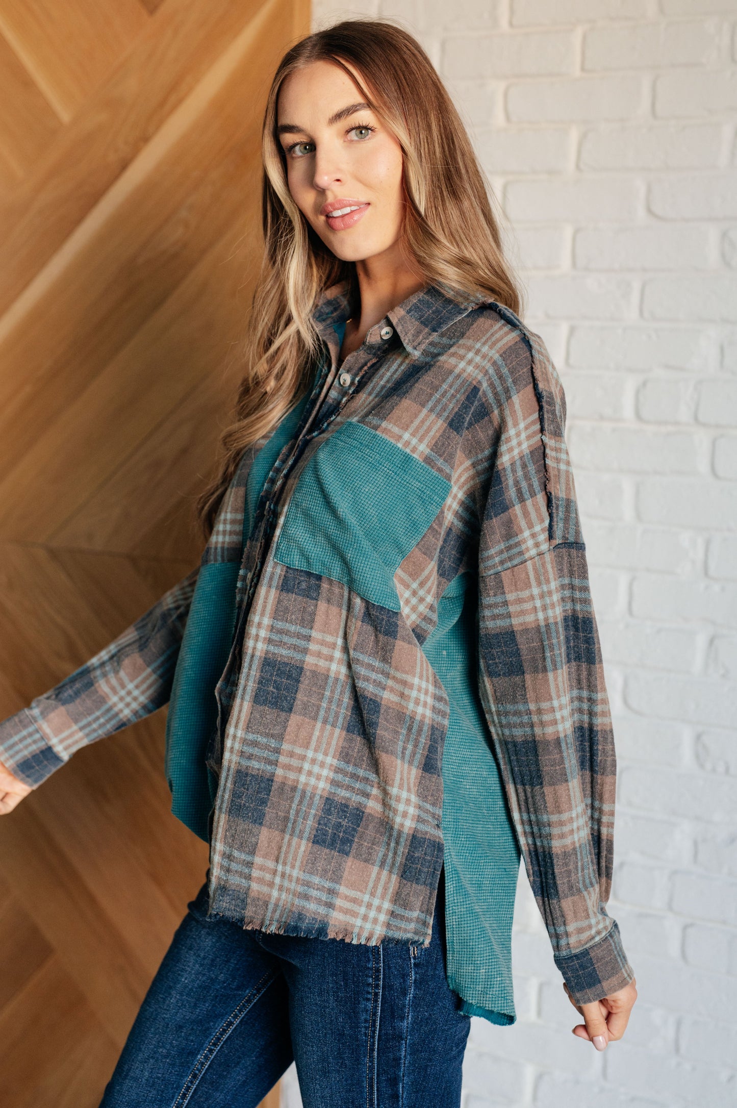 Women's teal plaid button-up shirt with a mix of flannel and waffle knit, featuring chest pockets, button-up closure, and a raw hem for a modern and stylish look.