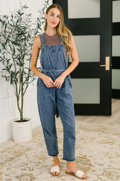 Tobin Waist Tie Overalls front view in lightweight chambray, square neckline, adjustable straps, and waist tie