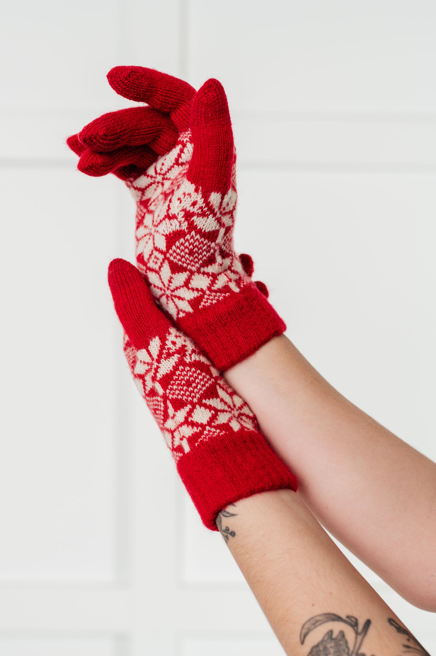  Women's red patterned knit gloves, touch screen compatible with elastic cuff.