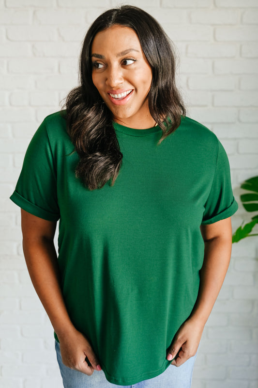 Plus size model wearing Ula Crew T-Shirt in green, relaxed fit with short sleeves and crew neckline