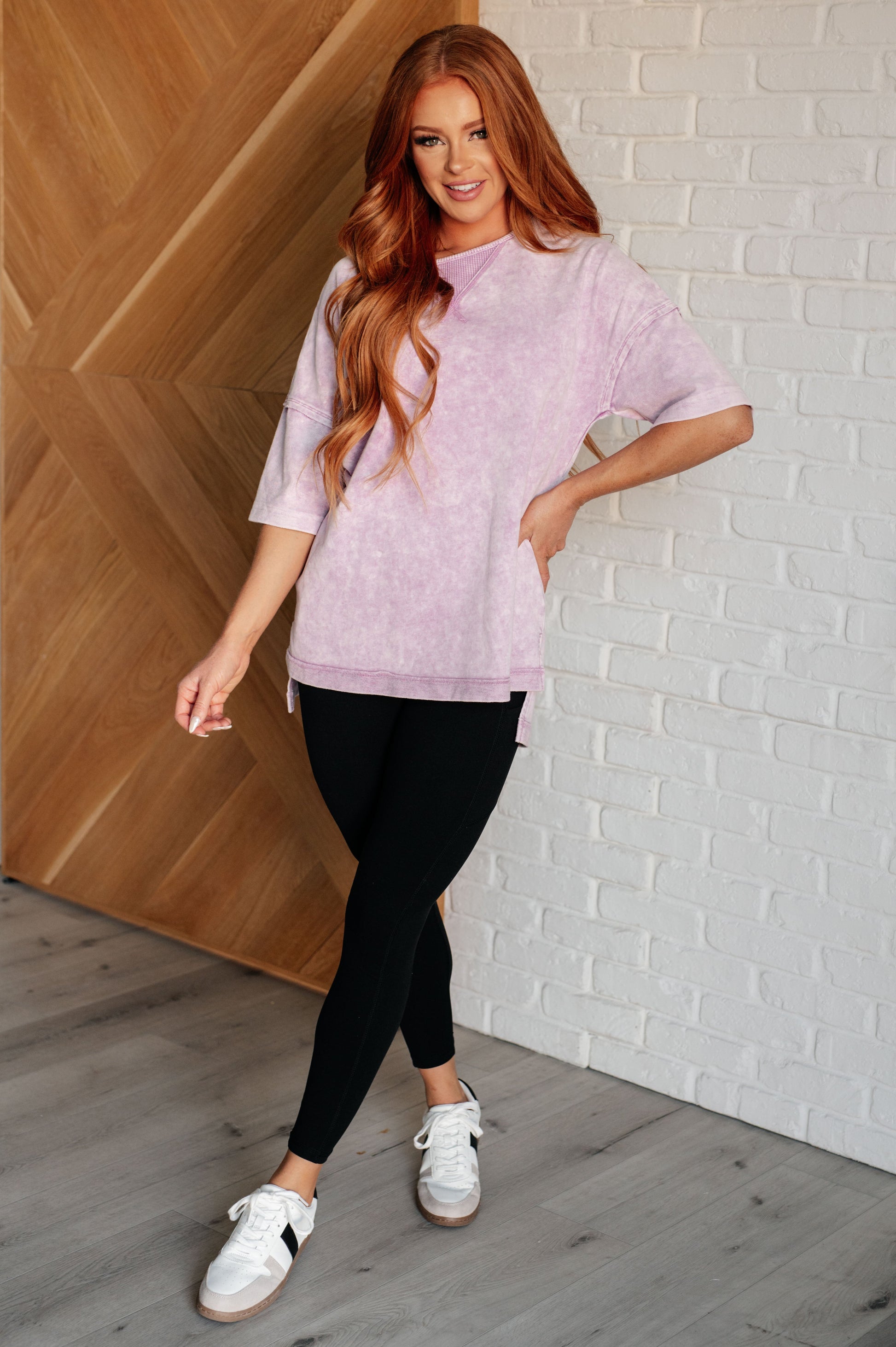 Women's Ubon Mineral Wash Top in Orchid Petal featuring a round neck, short sleeves with drop shoulders, raw edge details, stepped hem, and side slits. Made with French terry and waffle knit contrast fabric for a laid-back, effortless look.