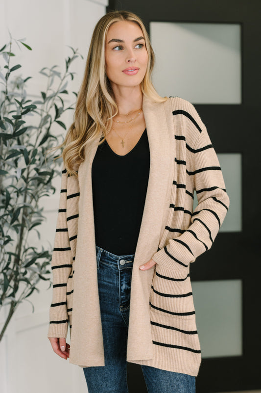 Front view of Keziah Striped Cardigan in taupe with black stripes and open front design.