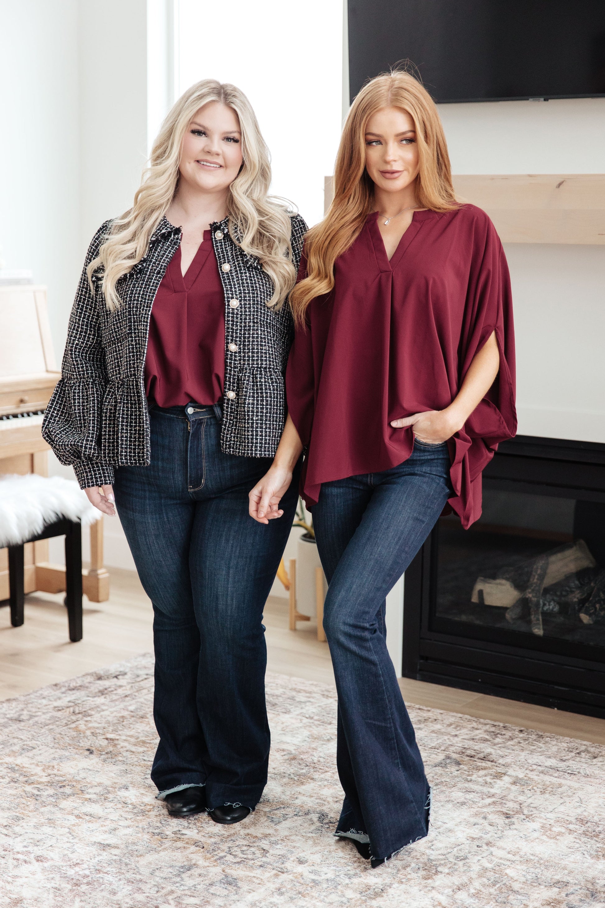 Women's wine-colored poncho-style blouse with a Gabby V-neckline, batwing sleeves, and an oversized fit, made from lightweight woven fabric.