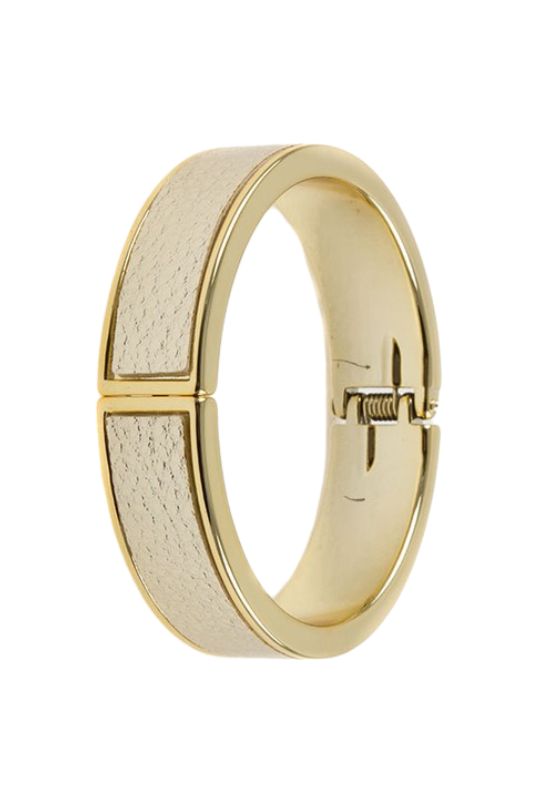 Gold hinged bangle bracelet with cream leather insert.