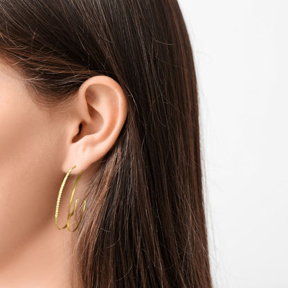 Model wearing Double Open Top Hoop Earrings with dimensional open-top gold hoop design