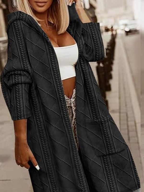 Makeda Hooded Cable Knit Cardigan in black, front view with pockets and relaxed fit.
