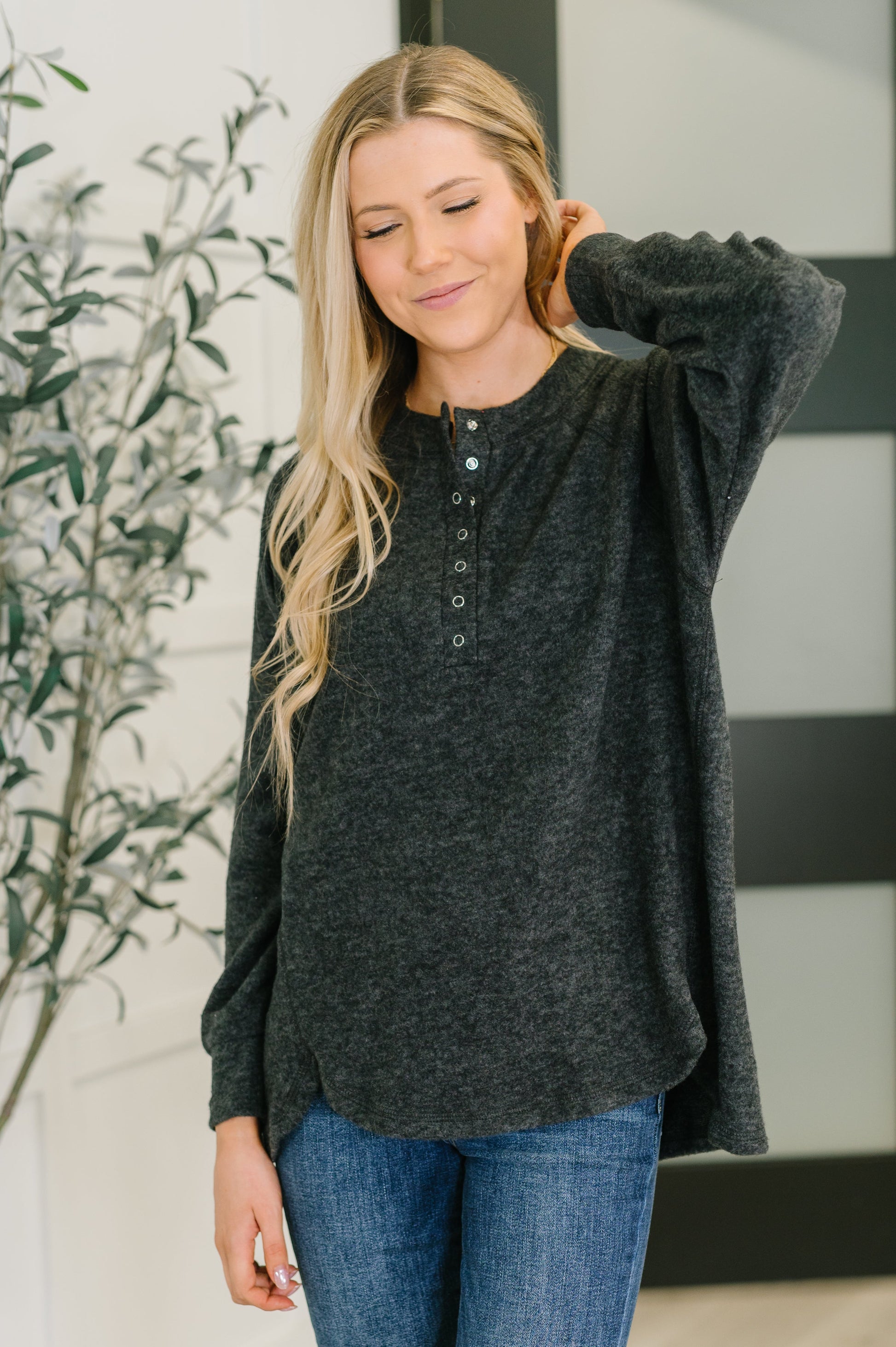 Murphy Black Pullover with snap front and hi-low hem.