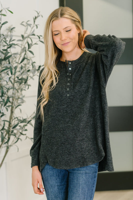 Murphy Black Pullover with snap front and hi-low hem.