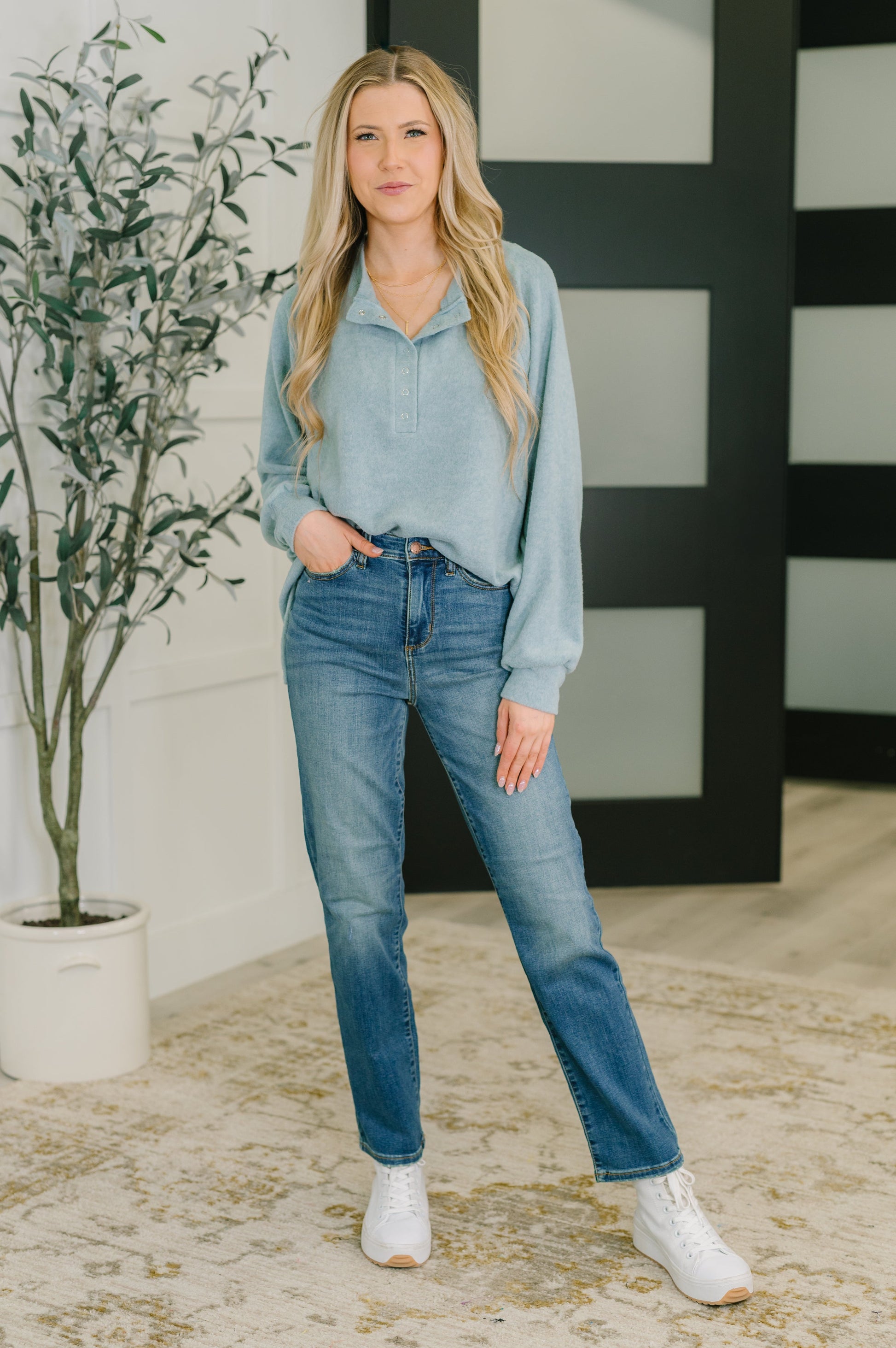 Model wearing Murphy Blue Grey Pullover with jeans and sneakers.