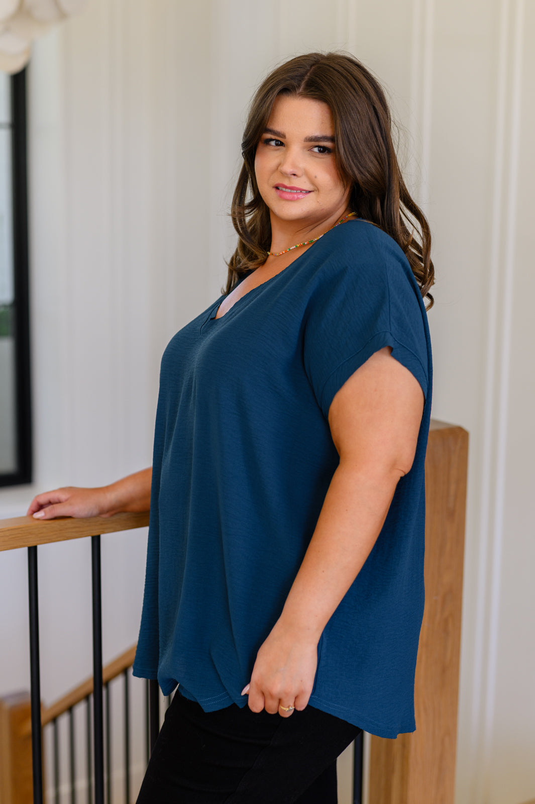 Women's V-Neck Top in Deep Teal, crafted from crinkle woven fabric with a flattering v-neckline and flowy fit.