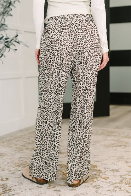 Back angle of Wania Leopard Drawstring Pants highlighting relaxed wide leg and leopard print design.