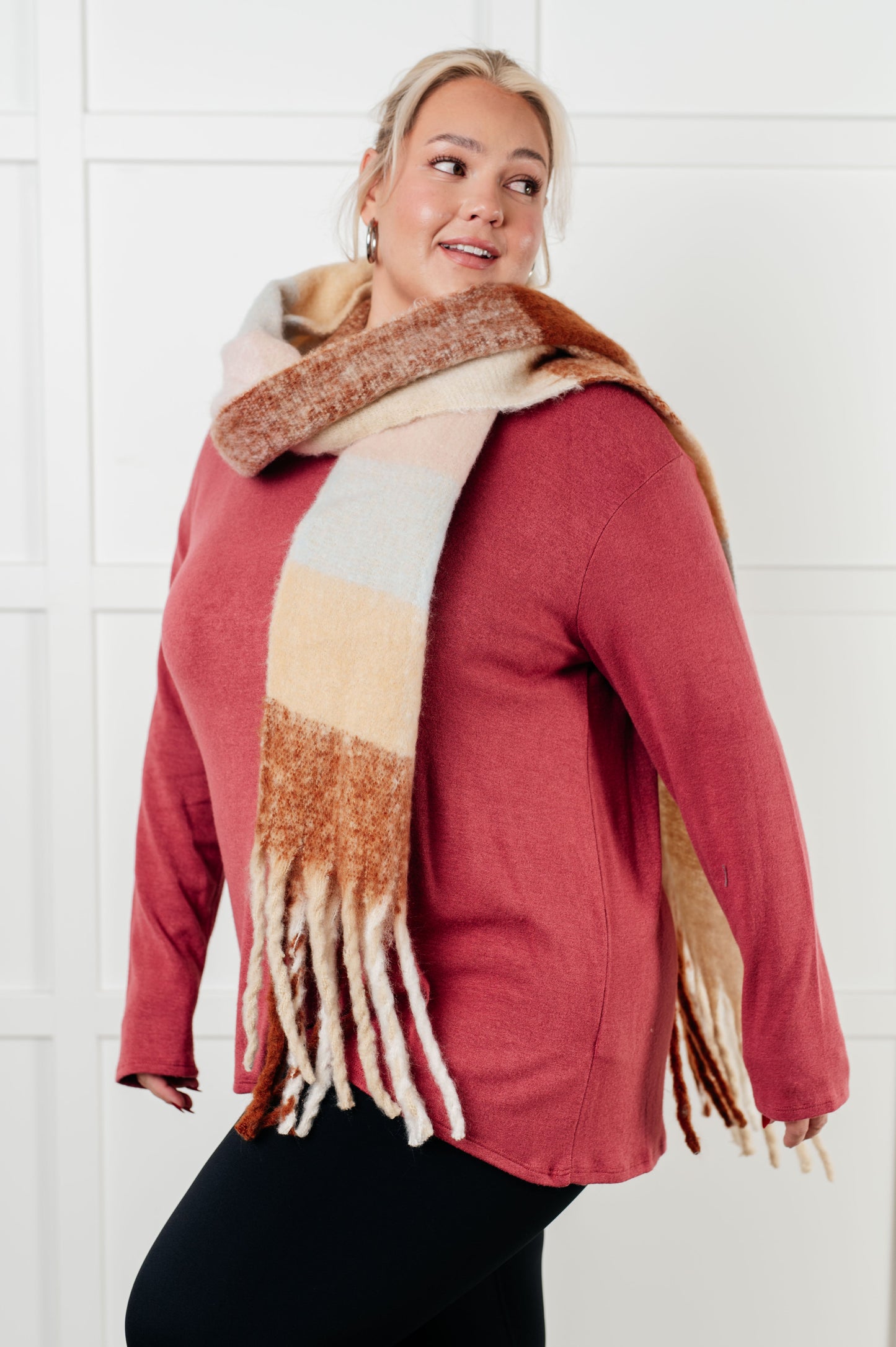 Women's oversized plaid fringe scarf in light brown.