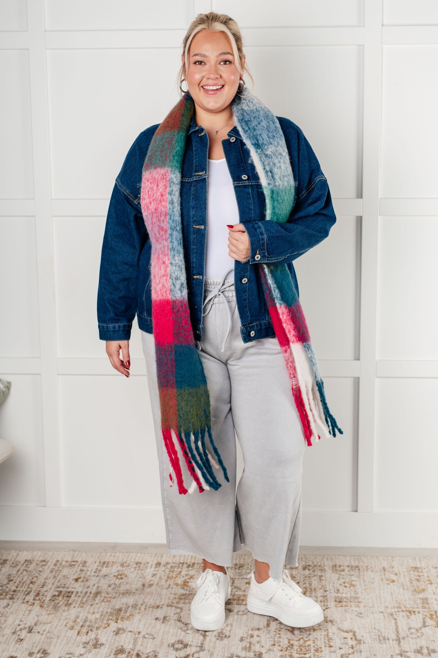 Women's oversized plaid fringe scarf in magenta and teal.