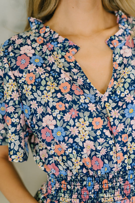 Close up of Wania Notch Neck Midi Dress neck ruffle and notch neckline detail.