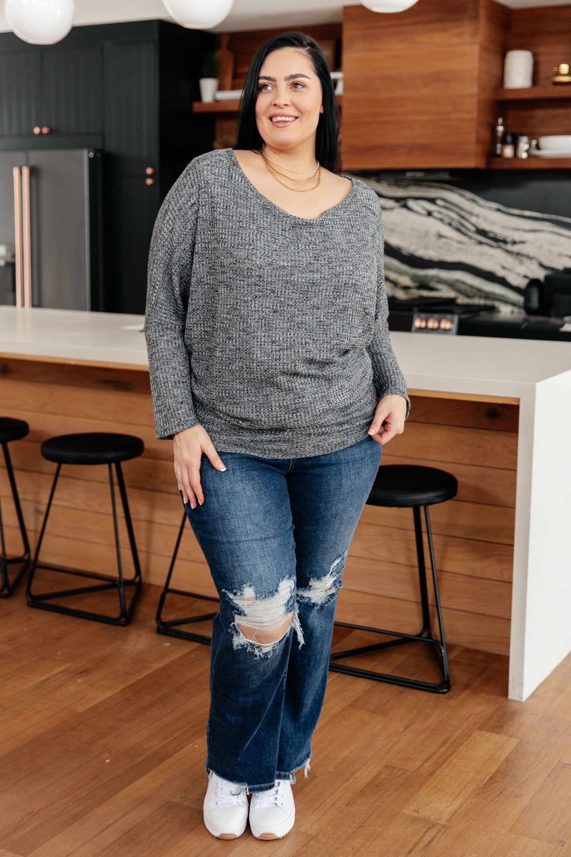 Charcoal waffle knit ribbed top with a wide boat neckline, long dolman sleeves, and a relaxed fit.