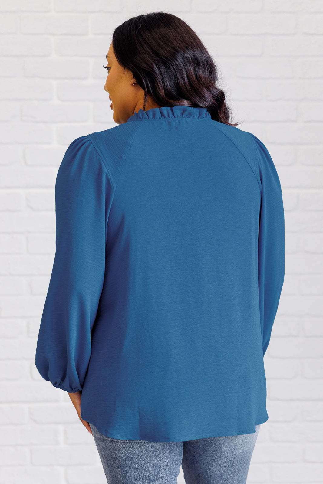 Plus size back view of Vesper Keyhole Tie Blouse showing textured fabric and classic flowy silhouette.