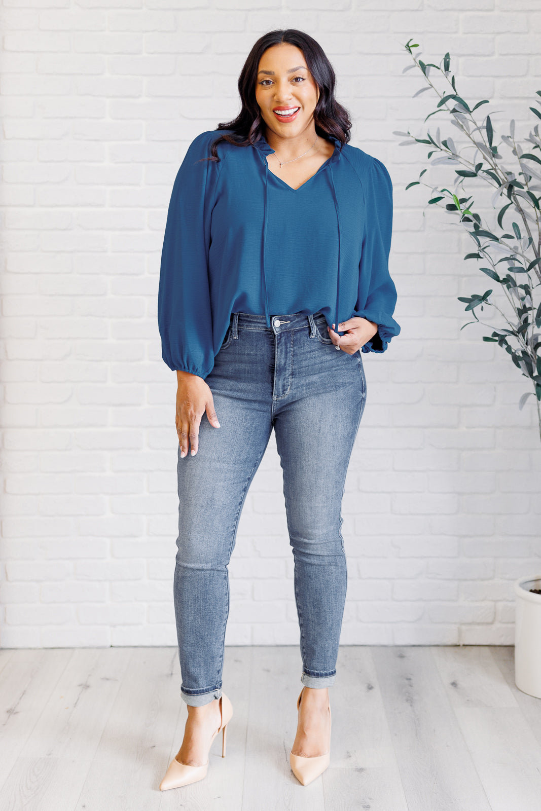 Plus size full body view of Vesper Keyhole Tie Blouse showing ruffle neckline and keyhole tie closure.