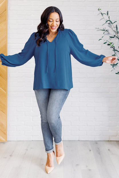 Plus size full body view of Vesper Keyhole Tie Blouse styled with relaxed fit in peacock.