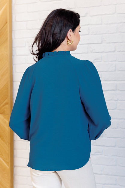 Back view of Vesper Keyhole Tie Blouse in peacock woven fabric with relaxed, lightweight fit.