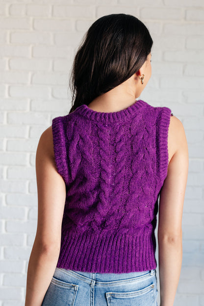 Back view of purple Hana Cable Knit Vest with wide ribbed trim.