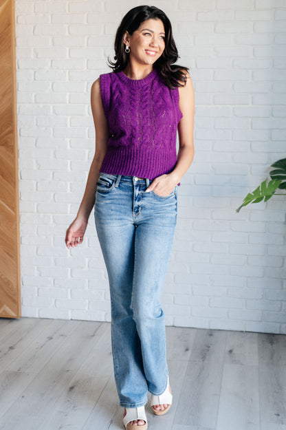 Full body look styled with jeans and Hana purple cable knit vest.
