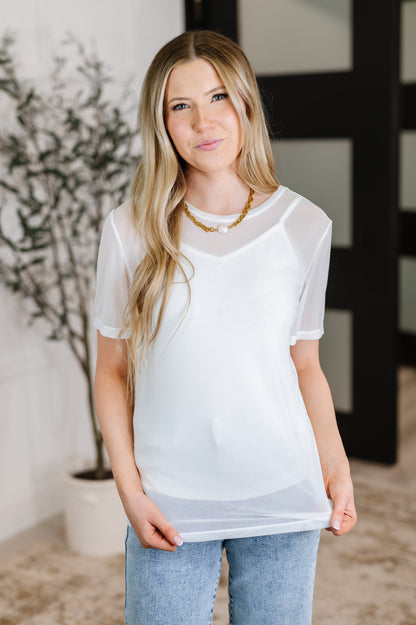 Front view of Marisol Layered Mesh Top styled with jeans.