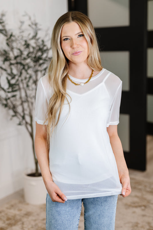 Front view of Marisol Layered Mesh Top styled with jeans.