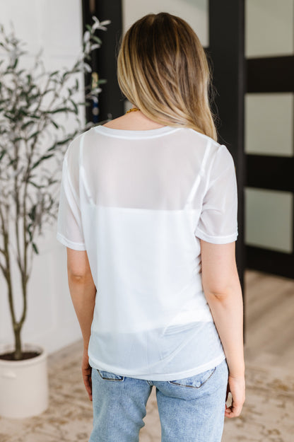  Back view of Marisol Layered Mesh Top showing layered mesh design and adjustable straps.