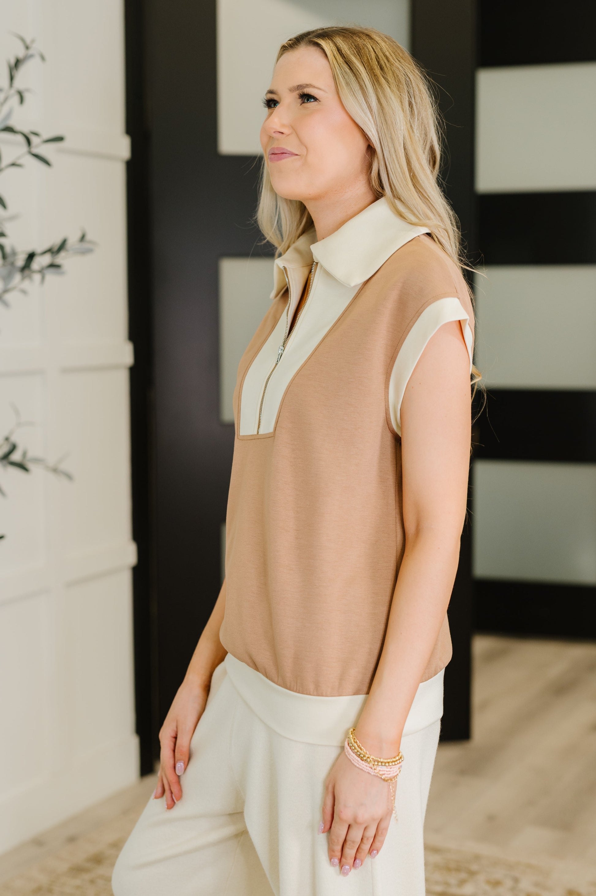 Side profile of Jovie Color Block Half Zip Top highlighting scuba knit fabric and half zip neckline.