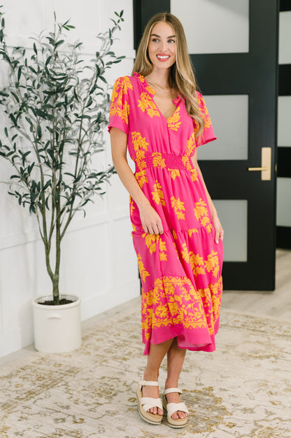 Full body view of model wearing the Lainey V-Neck Dress in fuchsia, styled with sandals to showcase a breezy, feminine look.