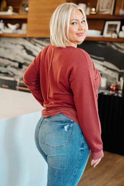 Plus size back view of red Taya Pullover with stepped hem and relaxed dropped shoulder fit.