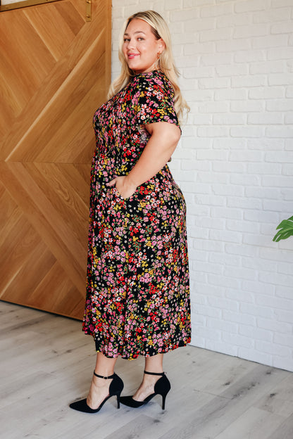 Anne Floral Dress with smocked waist, v-neckline, and flutter sleeves for a feminine, flattering fit.

