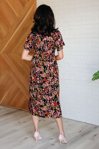 Back view - Floral Midi Dress with pockets, smocked bodice, and flirty flutter sleeves.

