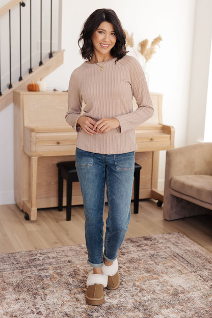 Model full body view in Marlo Cable Detail Top, styled with jeans, soft beige textured knit top