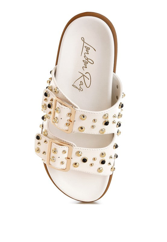 Trendy white studded sliders with 1-inch heel and soft footbed for stylish all-day wear.