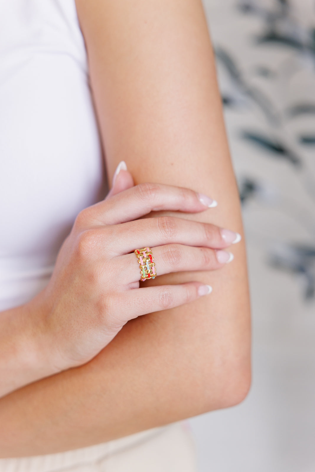 Woven in Color Ring featuring a multi-color design, made with hypoallergenic 18K gold-plated stainless steel.