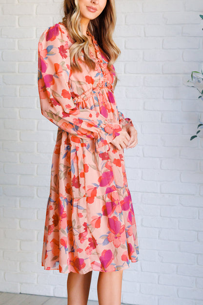 Side view of Maci Floral Midi Dress showing flowy peach floral chiffon and flattering empire waistline