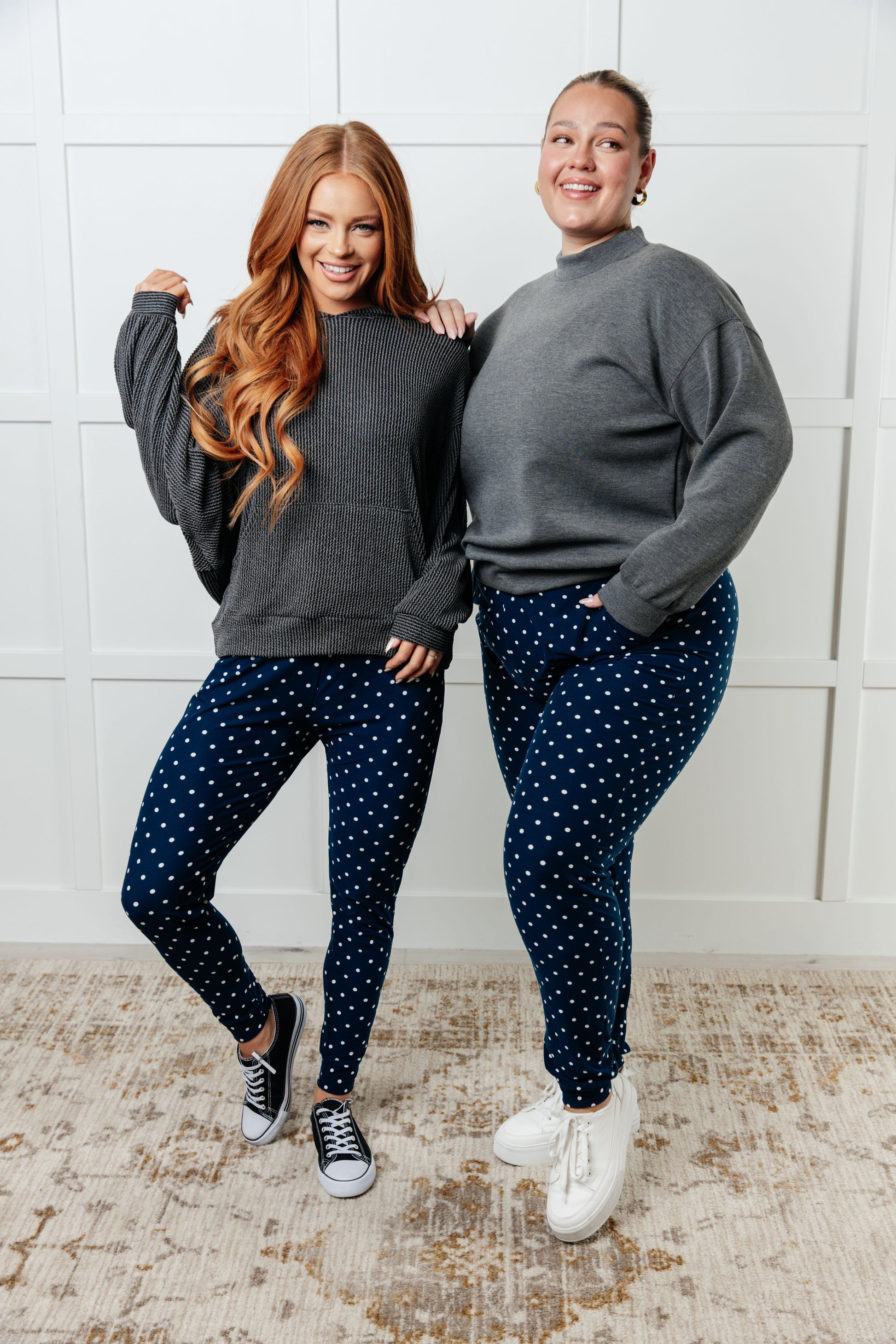 Women's joggers made from double-brushed microfiber in navy with a white polka-dot print, featuring an elastic waistband, functional drawstring, and pockets.