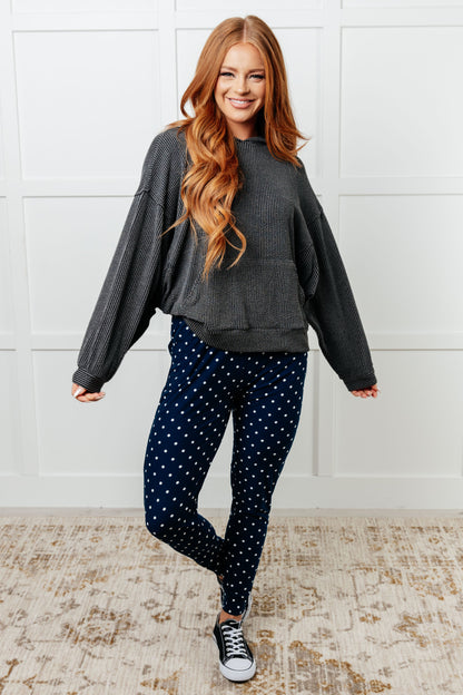 Full body view of Merrick White Polka Dot Joggers styled with a casual top, showing tapered fit and playful print.