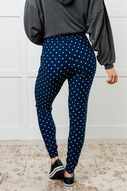 Back view of Merrick White Polka Dot Joggers on standard model, showing relaxed fit and tapered ankle cuffs.