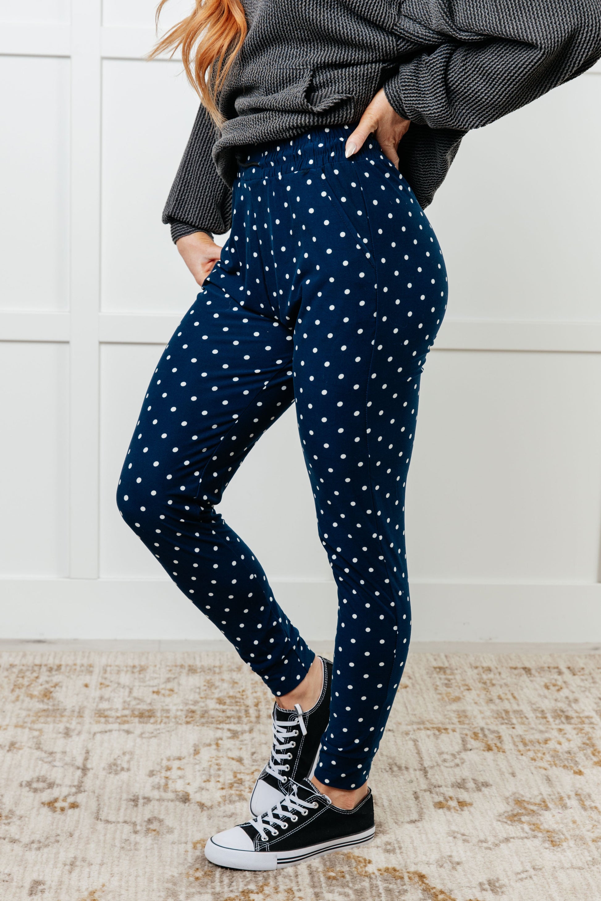 Women's joggers made from double-brushed microfiber in navy with a white polka-dot print, featuring an elastic waistband, functional drawstring, and pockets.